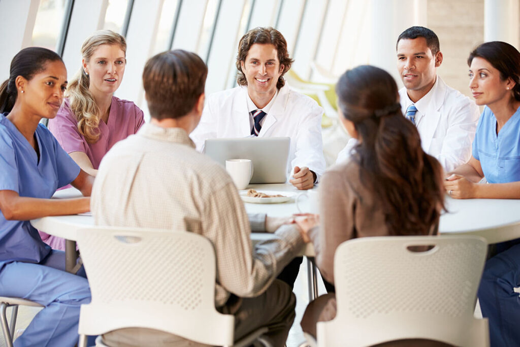 An image of a pharmacist at a MAC meeting